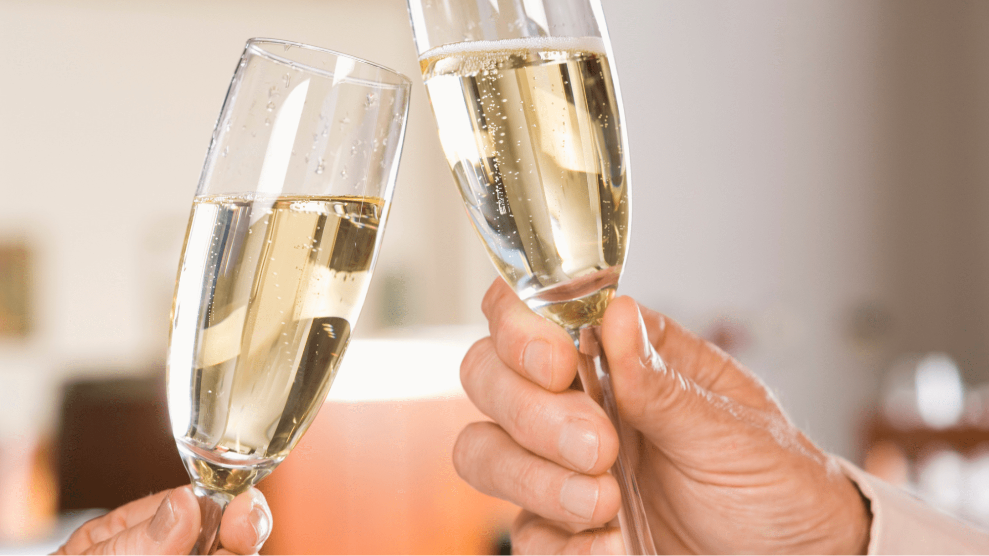Cheersing two champagne flutes