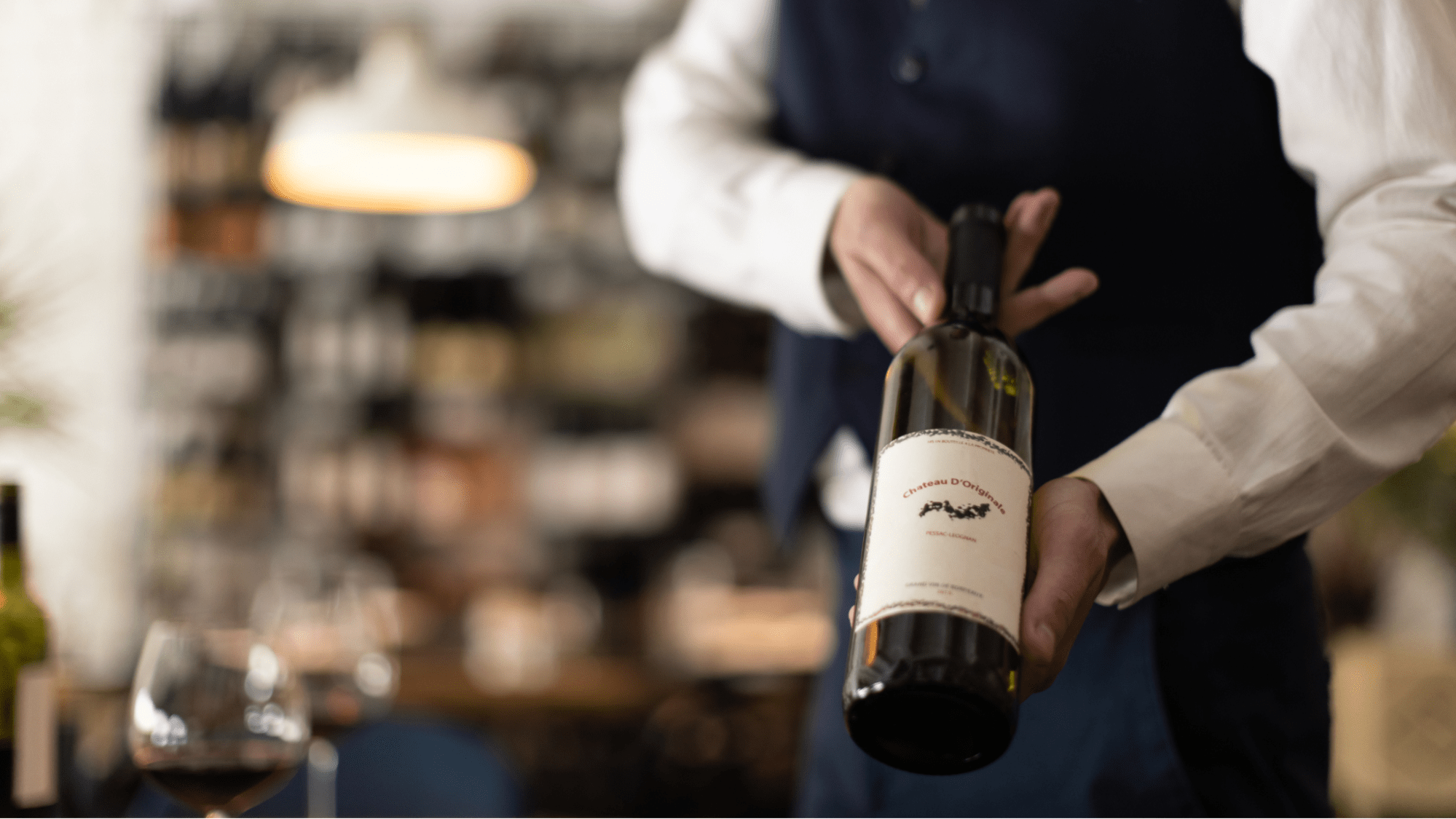 A sommelier presenting a bottle of wine